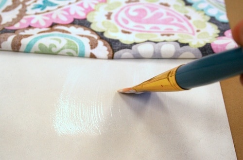 Covering the back of the frame insert with Mod Podge